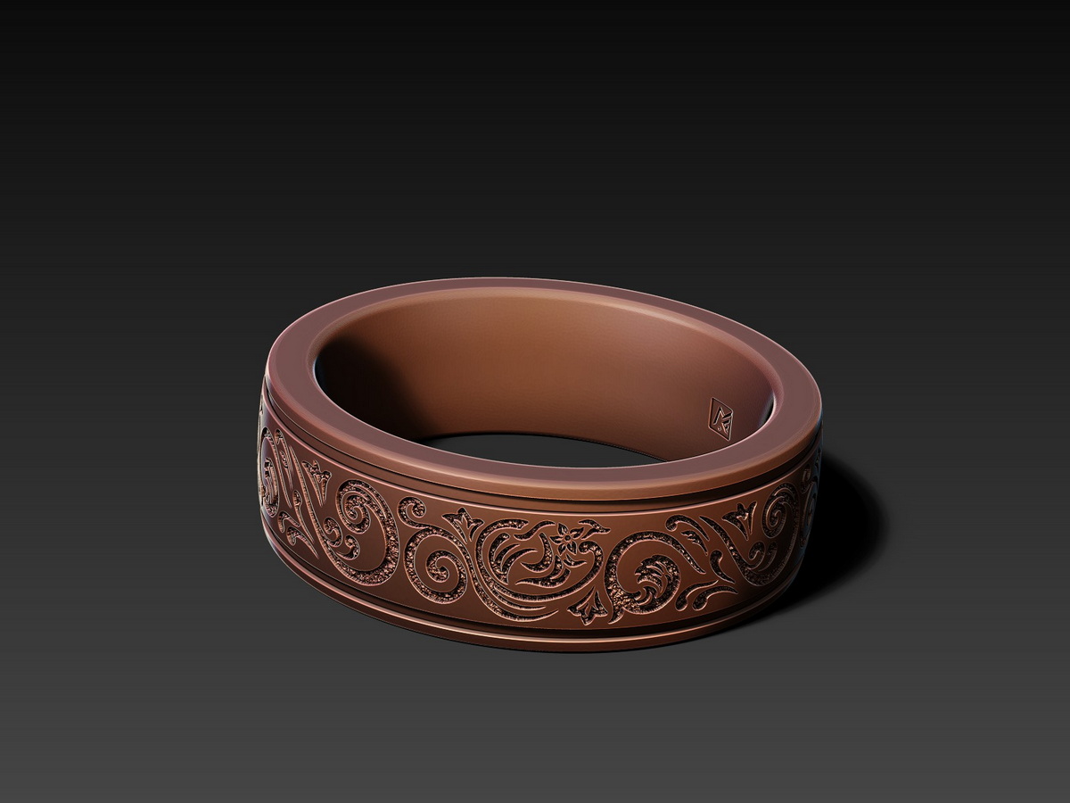 Ornamental ring with a deep engraved ornamental pattern shown in a warm bronze finish, emphasizing the contrast and depth of the design.